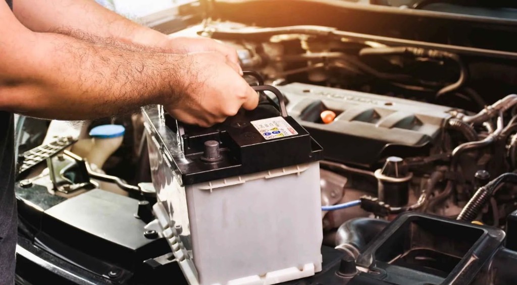 Rapid Roadside technician replacing a car battery